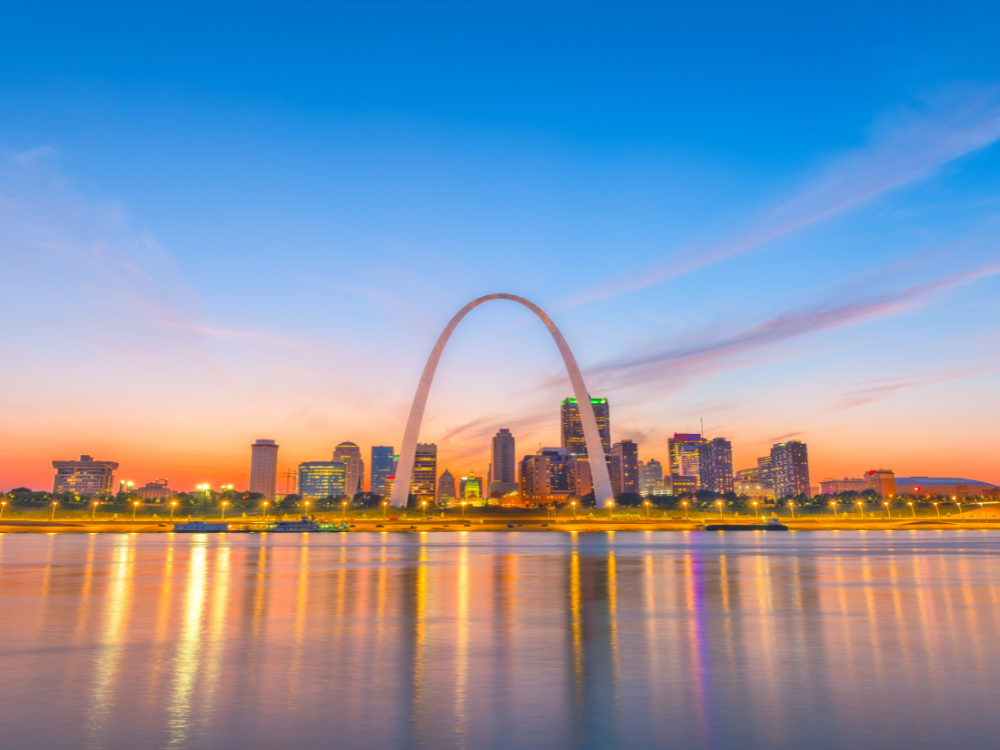 St. Louis, MO, arch shown at sunset in the city with historic Black travel site listed in the Green Books in Missouri.