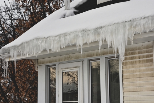 Melting snow on roof creates an ice dam.